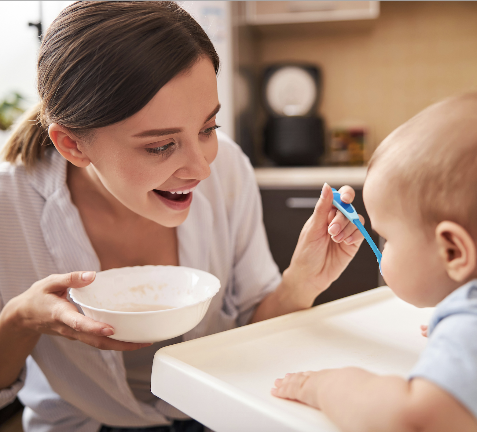 woman feeding baby